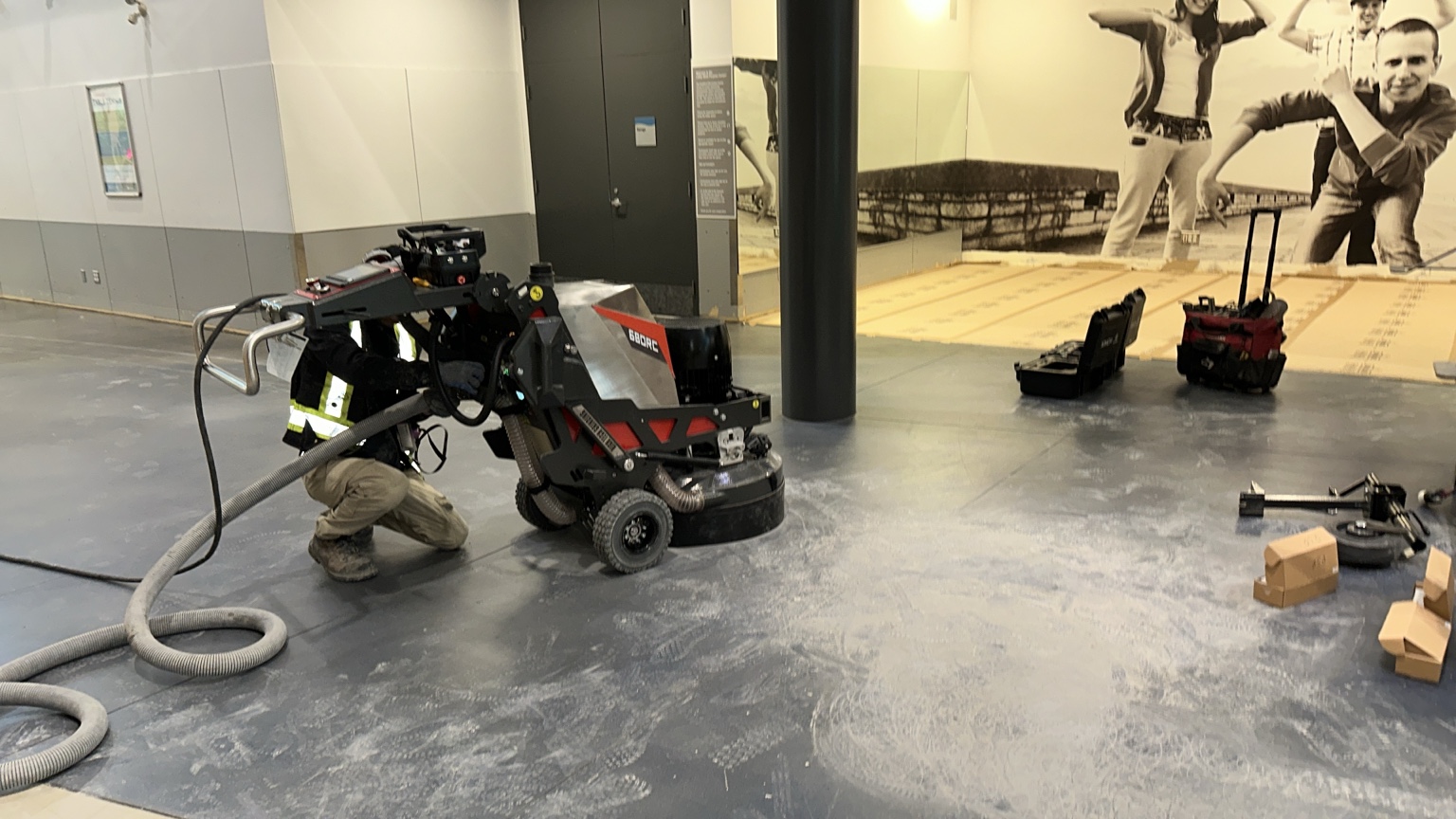 Concrete polishing equipment in operation